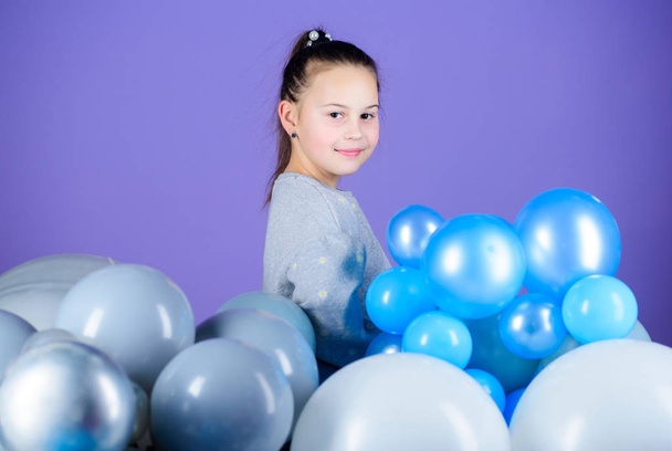 All those balloons for me. Happiness positive emotions. Obsessed with air balloons. Having fun. Balloons theme party. Girl between air balloons. Birthday party. Childrens day. Carefree childhood - Фото, изображение