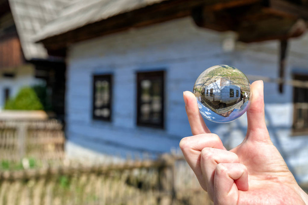Crystal lensball and folk architecture in musem of the Slovak vi - Photo, Image