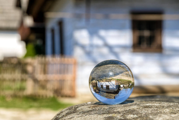Crystal lensball and rural cottages in musem of the Slovak villa - Photo, Image