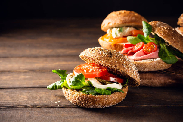 Italian Caprese sandwiches with fresh tomatoes, mozzarella cheese - Фото, зображення