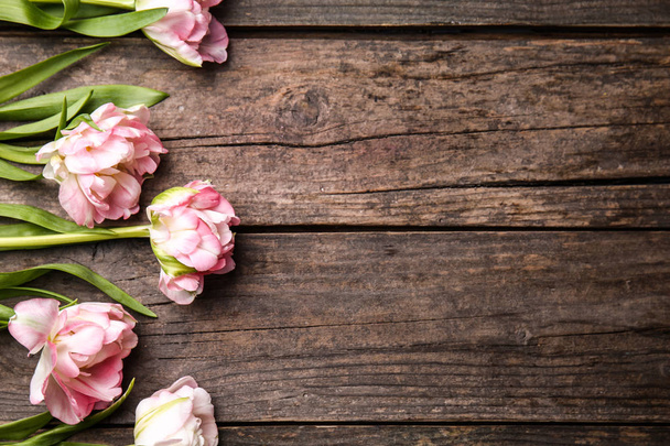Beautiful tulips on wooden background - Photo, Image