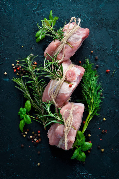 Raw meat, medallions with rosemary and spices. On a white wooden background. Top view. Free copy space. - Фото, зображення