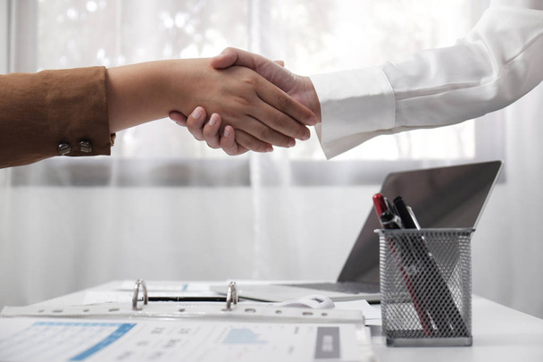 two young female professional shaking hand business concept. - Photo, Image