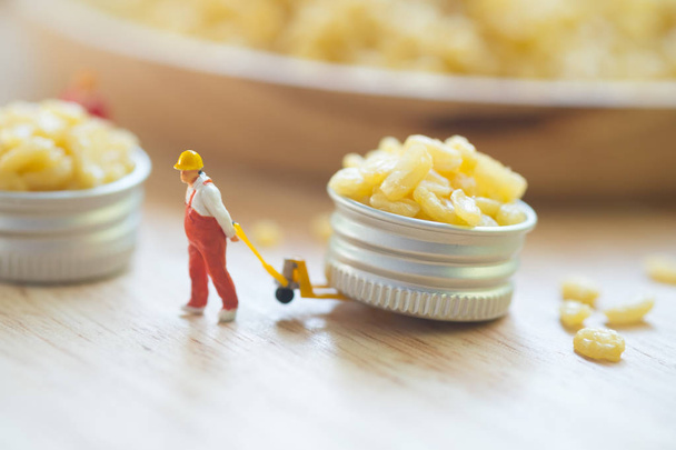 Miniature people workers moving fried mung bean (Thai appetizer) - Photo, Image