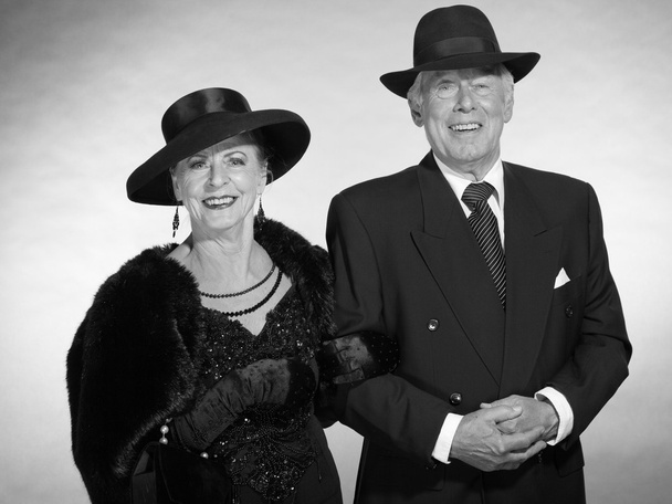 Vintage glamour senior couple wearing black hat. Black and white - Foto, Imagen