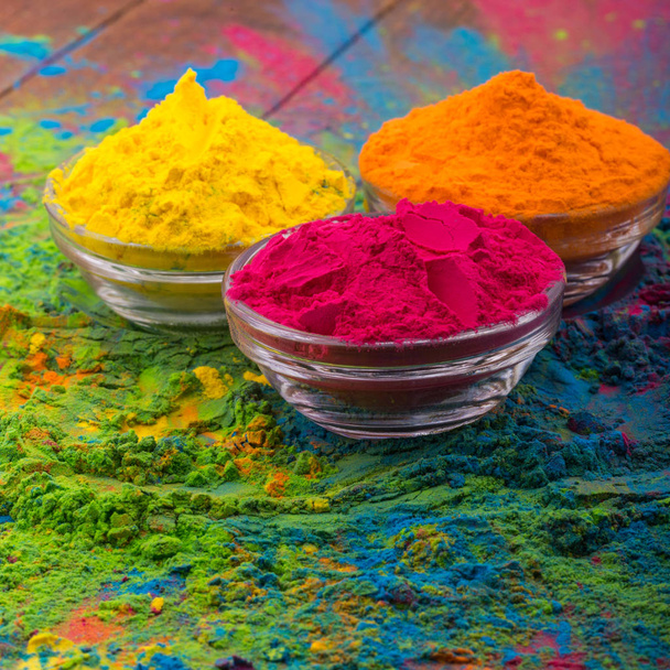 Holi color powder. Organic Gulal colours in bowl for Holi festival, Hindu tradition festive. Bright vibrant pigment closeup - Φωτογραφία, εικόνα