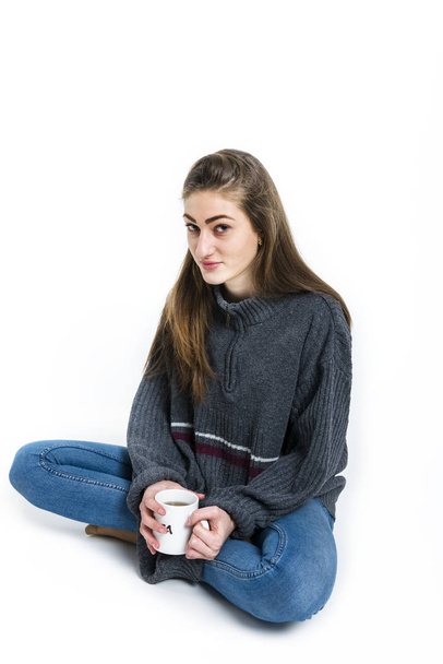 A girl with a hot mug of tea - Фото, изображение