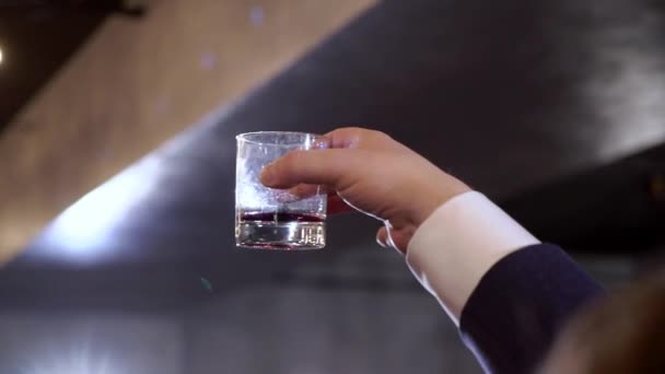 Mens hand holding wine glass at festive - Video, Çekim
