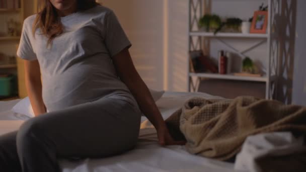 Pregnant lady lying bed and falling asleep at sunset, night routine, recreation - Footage, Video
