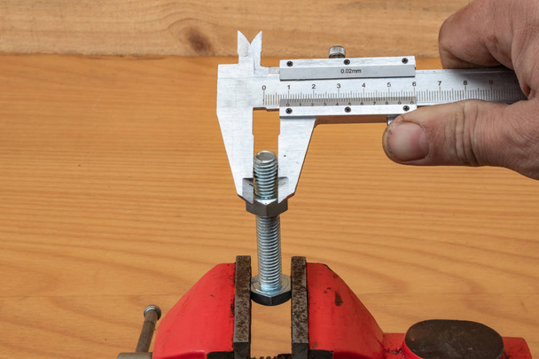 Bolt diameter measurement technology using calipers - Photo, Image