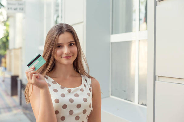 Cheerful female with credit card - Zdjęcie, obraz