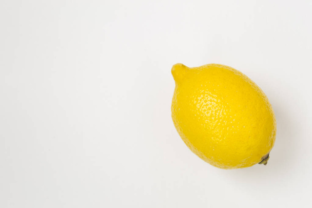 Ripe yellow lemon on white background - Fotografie, Obrázek