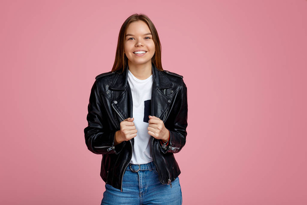 Photo of beautiful young woman with bright smile over pink background. - Fotografie, Obrázek