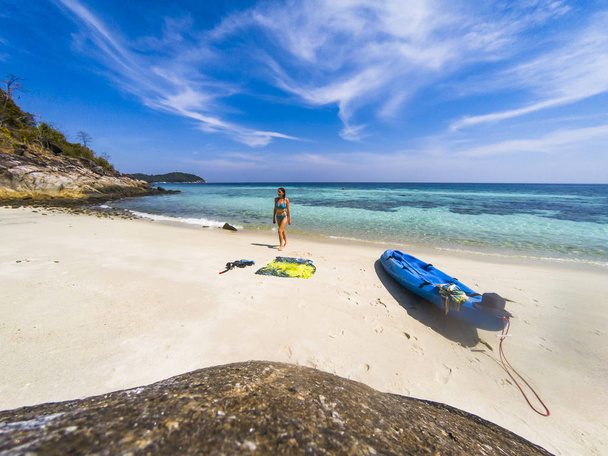 woman with a kayak on an isolated beach in Andaman sea, Koh Lipe - Photo, Image