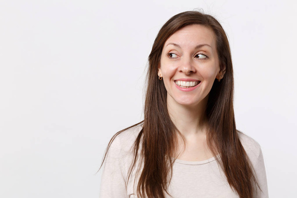 Portrait of smiling joyful pretty young woman in light clothes s - Fotografie, Obrázek