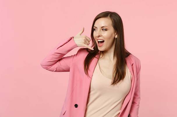 Cheerful stunning young woman in jacket doing phone gesture like - Fotografie, Obrázek