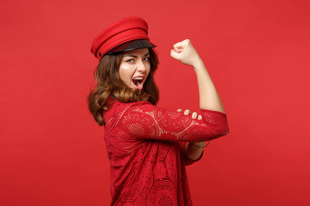 Portrait of cheerful strong young woman in lace dress and cap sh - Photo, Image