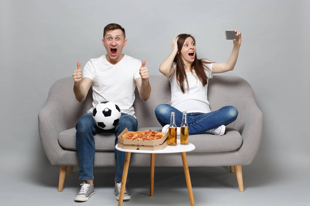 Excited couple woman man football fans cheer up support favorite - Photo, Image