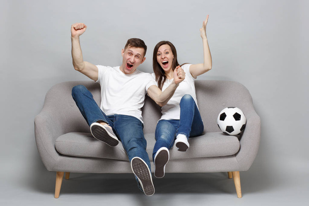 Overjoyed couple woman man football fans cheer up support favori - Photo, Image