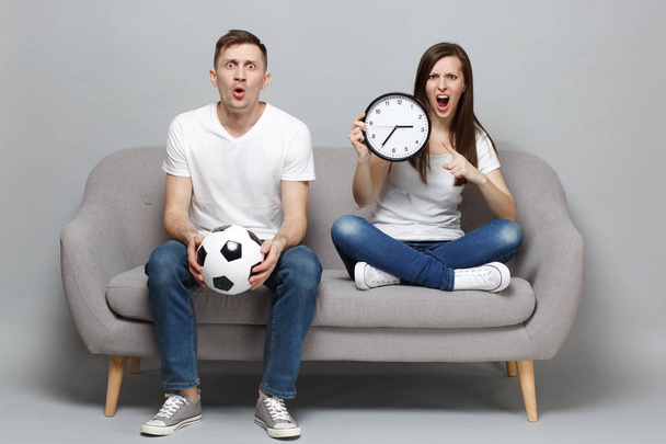 Shocked angry couple woman man football fans in white t-shirt ch - Photo, Image