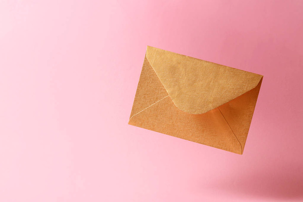 The envelope falls to the ground on a colored background. - Fotó, kép