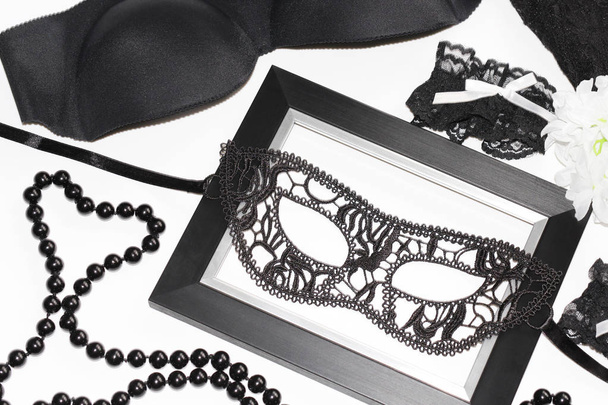 Black sexy lace mask for women. Flat lay. - Фото, изображение