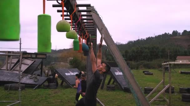Participant obstacle course doing suspension - Footage, Video