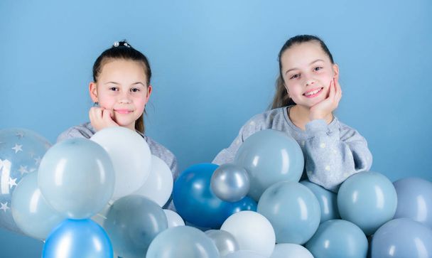Happiness and cheerful moments. Carefree childhood. Sisters organize home party. Having fun concept. Balloon theme party. Girls best friends near air balloons. Start this party. Birthday party - Photo, image