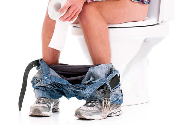 Man on toilet bowl - Foto, Bild