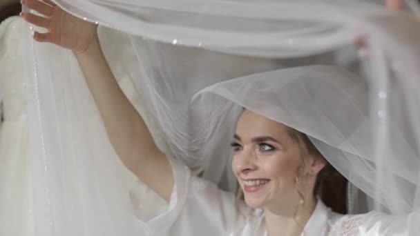 Beautiful and lovely bride in night gown under huge veil. Wedding morning - Footage, Video