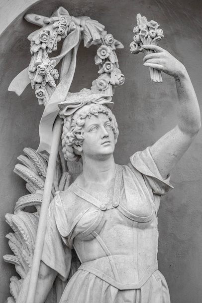 Statue of sensual busty and puffy renaissance era woman in circl - Photo, Image