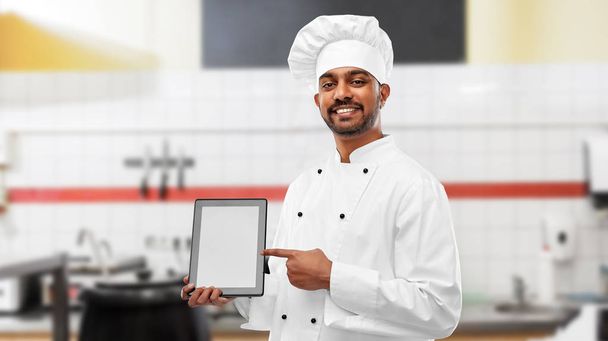 indian chef with tablet pc at restaurant kitchen - 写真・画像