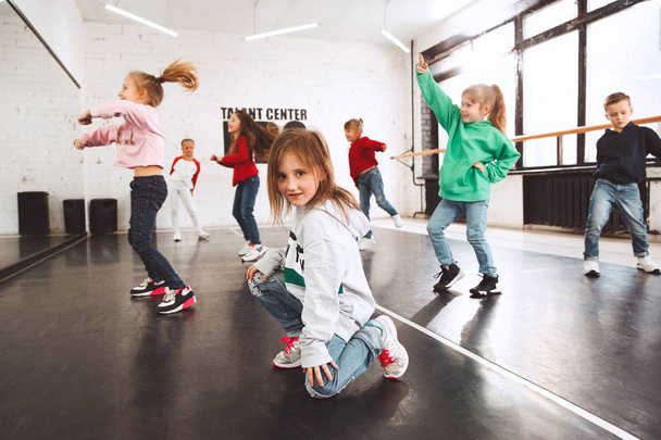The kids at dance school. Ballet, hiphop, street, funky and modern dancers - Fotó, kép