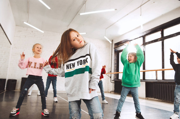 The kids at dance school. Ballet, hiphop, street, funky and modern dancers - Фото, изображение
