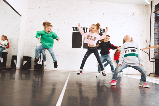 The kids at dance school. Ballet, hiphop, street, funky and modern dancers - Photo, Image