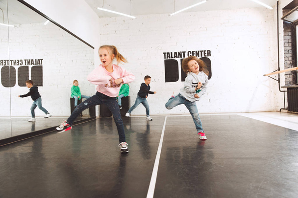 The kids at dance school. Ballet, hiphop, street, funky and modern dancers - Fotografie, Obrázek