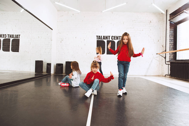 The kids at dance school. Ballet, hiphop, street, funky and modern dancers - Photo, image