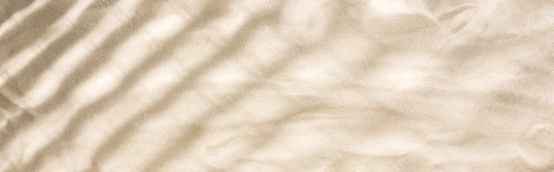 tiro panorâmico de areia com sombras e espaço de cópia
 - Foto, Imagem