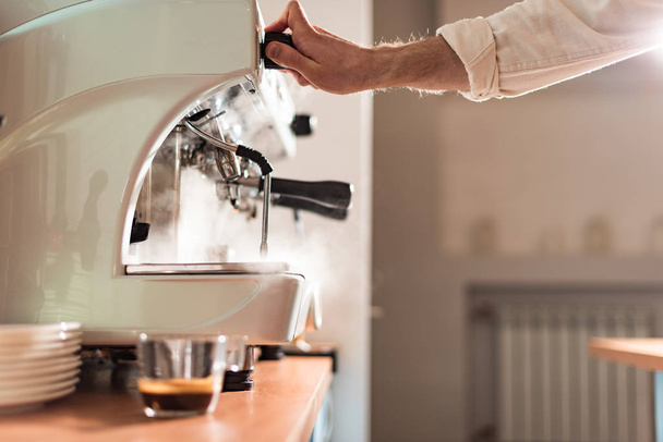 Cropped view of barista using coffee machine in cafe - Photo, Image