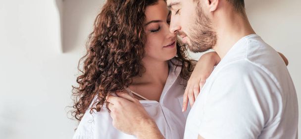 romantic couple gently touching each other with closed eyes - Фото, изображение