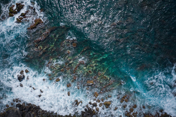 Aerial view to ocean waves. Blue water background. Photo made fr - Valokuva, kuva