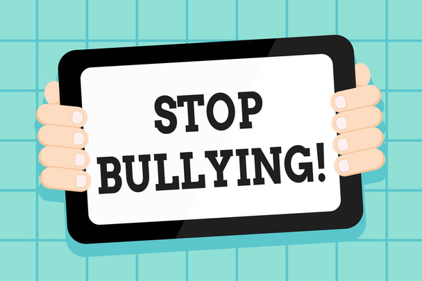 Conceptual hand writing showing Stop Bullying. Business photo showcasing no aggressive behavior among children power imbalance Color Tablet Smartphone with Screen Handheld Back of Gadget. - Photo, Image