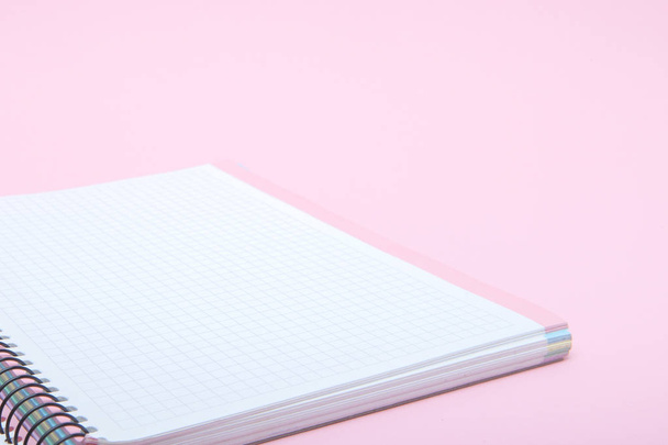 Notebook on pink background, lifestyle concept, top view. - Foto, immagini