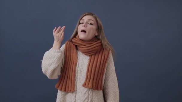 Sick girl wrapped in a warm scarf suffering from nose and headache - Filmagem, Vídeo
