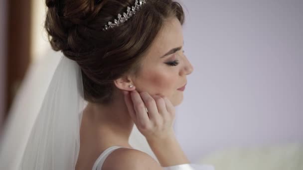 Beautiful and lovely bride in night gown. Wedding morning. Pretty well-groomed - Footage, Video