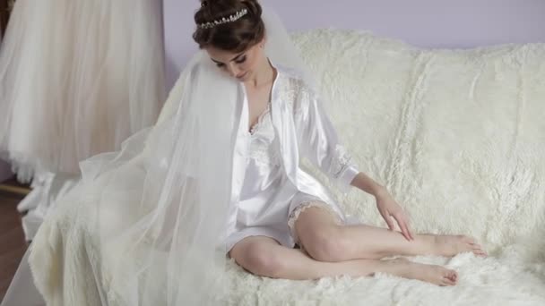 Beautiful and lovely bride in night gown. Wedding morning. Pretty well-groomed - Footage, Video