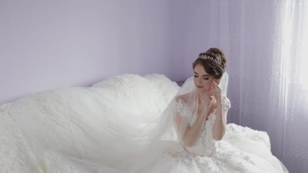 Beautiful and lovely bride in wedding dress. Pretty and well-groomed woman - Footage, Video