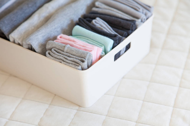 Basket or box with neatly folded colorful socks. Socks or clothe - Zdjęcie, obraz