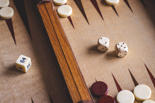 Backgammon board game. Playing leisure game. Dice on board.  - Photo, Image