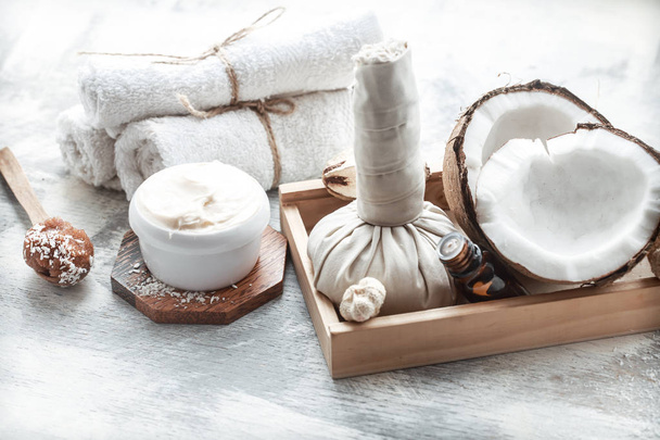 Spa still life with fresh coconut and body care products - Photo, Image